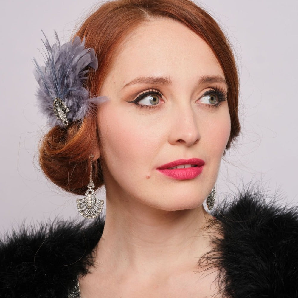 Grey 1920s feather headpiece as worn by a red haired model