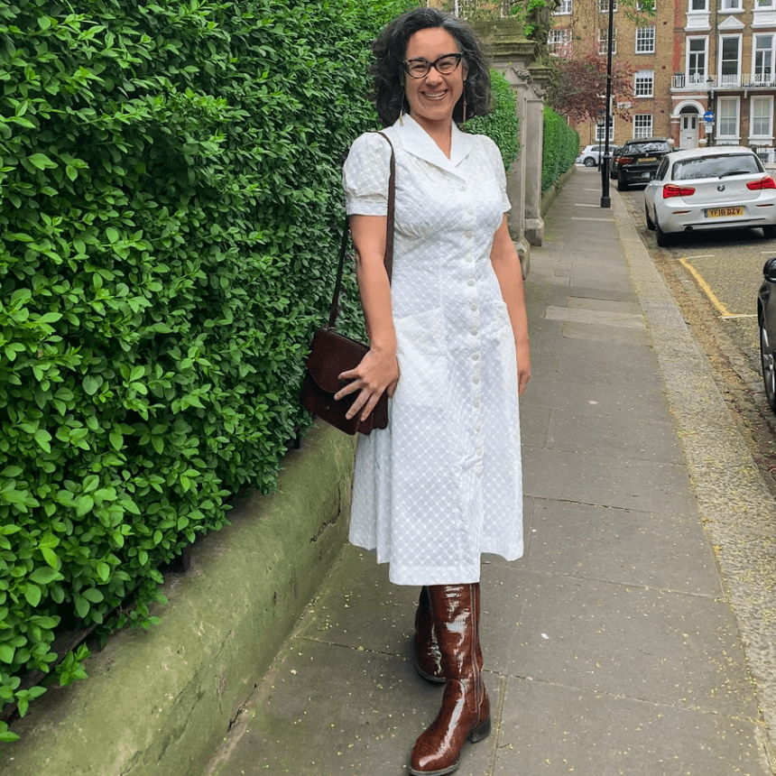 1940s shirt dress in white broderie anglaise by Emmy Design Sweden from Revival Retro as worn by Rowena who has accessorised with knee high brown boots and vintage brown leather bag