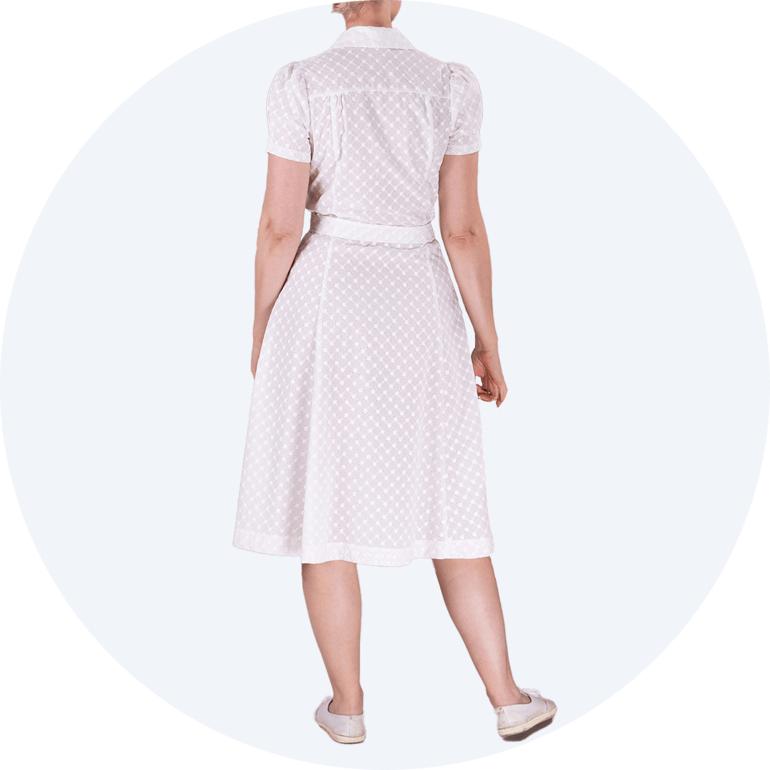 1940s shirt dress in white broderie anglaise as seen from behind
