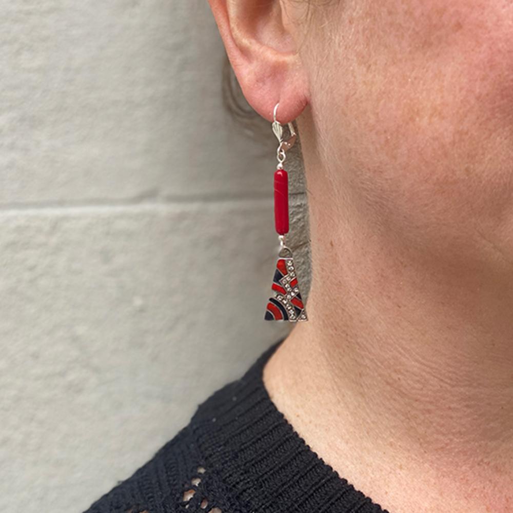 Art Deco drop earrings formed of a red tubular finding and trapeze metal pendant decorated with red and black enamel and diamantes