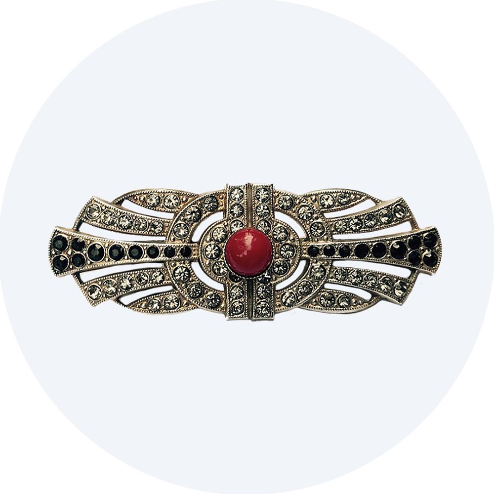 Art Deco brooch with red stone centre and clear and black diamante stone detailing